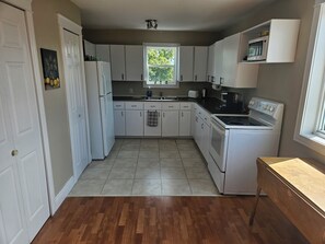 full kitchen with all cooking essentials.