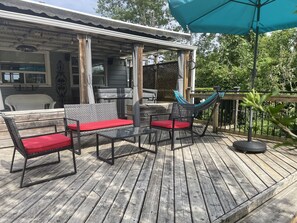 Backyard - hammock, outdoor seating, umbrella and hot tub