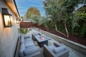 Patio with lounge seating, outdoor dining and gas grill