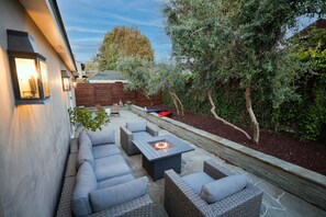 Patio with lounge seating, outdoor dining and gas grill