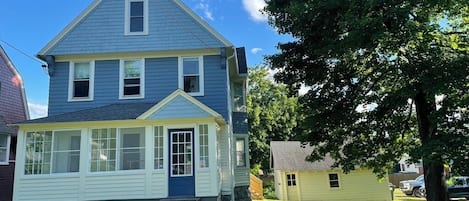 Sunny day in the Berkshires! Front of house including breezy screened porch.