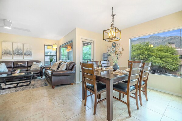 Optimized: Spacious, light-filled living room seamlessly flows into a dining area, perfect for entertaining guests or relaxing evenings.