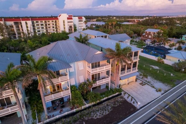 Our home is the gray one in the middle. We have more deck furniture now.