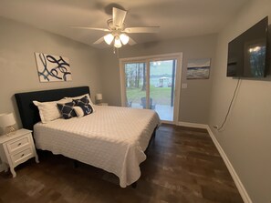 Bedroom #2 Queen size bed w/ smart tv & waterfront views with sliders to patio 