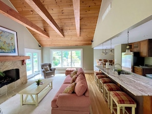 The vaulted-ceiling family room and stone island make for the perfect hangout.