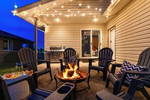 Patio with Firepit, grill, and fully fenced yard