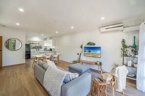 Open plan living room with flat screen TV