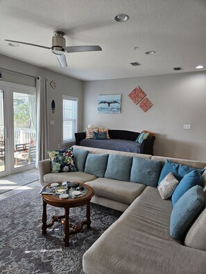 The beautiful, inviting living room that looks off the back porch. 
