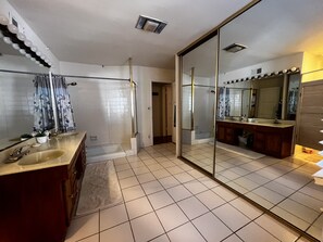 Huge bathroom! Closet and full length mirrors.  Fresh towels, toilet paper and toiletries.  Access from both rooms.