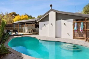 Spa, solar-heated pool, and alfresco entertaining area