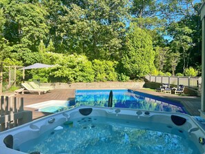 Hot tub for six overlooking pool.