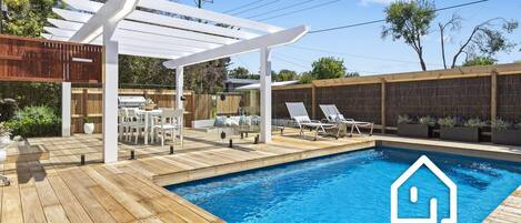 Enjoy your own private heated poolside oasis and outdoor dining area