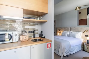 Nicely equipped kitchenette with a coffee machine, toaster, stove, kettle, and a microwave for your quick meals! #kitchen #cooking
