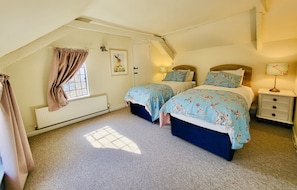 Bedroom three: twin beds (can be zipped together) drawers and courtyard views