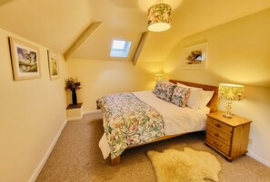 Bedroom one: King size, drawers, built-in wardrobe and views of the garden. 