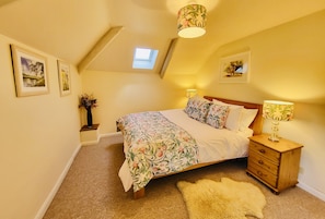 Bedroom one: King size, drawers, built-in wardrobe and views of the garden. 