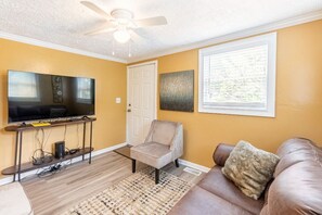 Living room with sofa bed and large screen TV