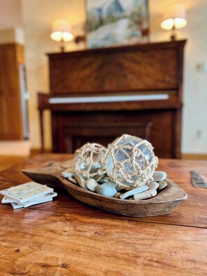 Grand living room with lake views, piano, fireplace and multiple gathering places. Rocks from Flathead Lake.