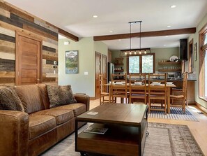 Open floor plan great room with dining room, living room and kitchen