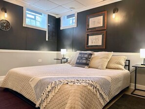 Cozy king sized bed in the bedroom nook.