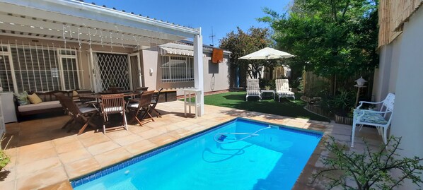 Relaxing outdoor area with pool 