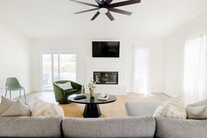 A great gathering place. Simple Peaceful Style. Natural Texture Style. Minimal. Serene. Peaceful. Jute Rug. Linen. Velvet Chair. Marble Coffee Table. TV w/ Netflix. Walk-out Patio to Sunny Pool Area and Covered Patio.