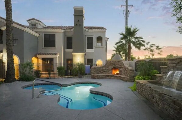 24 Hour Hot tub with fireplace, heated as well