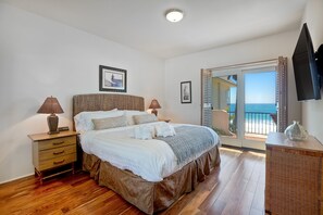Queen bed with comfortable bedding and guest towels