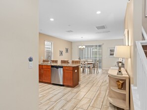 View of the kitchen and the dining areas from the entrance of the home