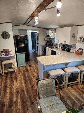Kitchen with bar and counter stool seating