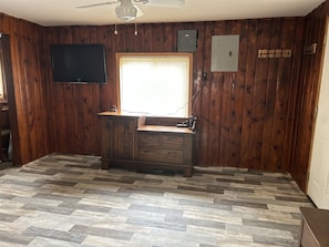 Livingroom with Smart TV, Roku stick. Coat hooks to hang jackets or dog lease.