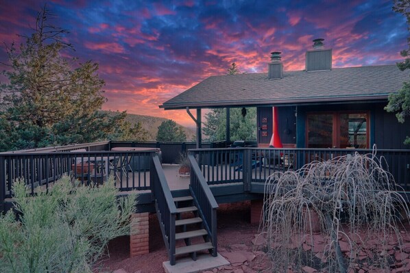 Escape to your own private deck with stunning views, hot tub, grill and retro fireplace.