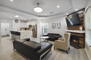 Welcome to your ultimate modern sanctuary — the living room where style meets comfort! Sink into sleek leather couches that scream luxury, surrounded by clean lines, bold accents, and a vibe so fresh it redefines contemporary living. This isn't just a liv