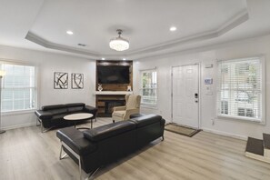 Welcome to your ultimate modern sanctuary — the living room where style meets comfort! Sink into sleek leather couches that scream luxury, surrounded by clean lines, bold accents, and a vibe so fresh it redefines contemporary living. This isn't just a liv