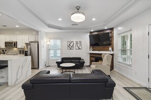 Welcome to your ultimate modern sanctuary — the living room where style meets comfort! Sink into sleek leather couches that scream luxury, surrounded by clean lines, bold accents, and a vibe so fresh it redefines contemporary living. This isn't just a liv