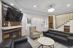 Welcome to your ultimate modern sanctuary — the living room where style meets comfort! Sink into sleek leather couches that scream luxury, surrounded by clean lines, bold accents, and a vibe so fresh it redefines contemporary living. This isn't just a liv