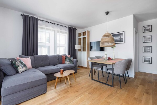 Living room with a comfortable sofa and TV. 