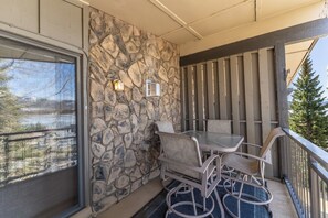 Private balcony with outdoor seating and breath taking mountain, lake and amphitheater views.