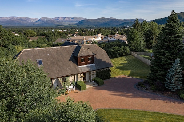 Black Grouse Lodge view of house and Cairngorm Mountains