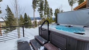 Soak sore muscles from skiing in the private hot tub while you enjoy the mountain views.