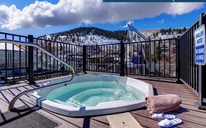 Rio Grande's Rooftop hot tub with lush green mountain views.