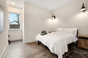 Our second bedroom has a Queen-size bed, closet and nearby bathroom.