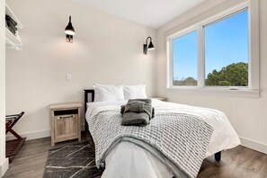 Our Primary bedroom has a Queen-size bed, a closet and an ensuite bathroom.