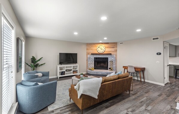 Spacious And Comfortable Living Area With 55" Smart TV and Fireplace