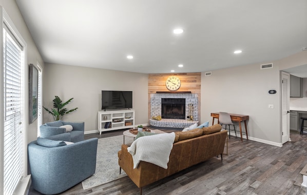 Spacious And Comfortable Living Area With 55" Smart TV and Fireplace