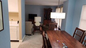 view from dining area, kitchen, and living area with tv