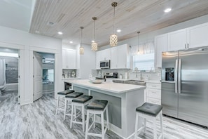 Open kitchen that allows you to never miss a convo while cooking for the family.