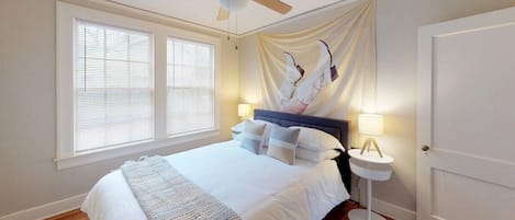 Guest Bedroom off the living room features a queen bed with safe rest encasement and fresh linens.