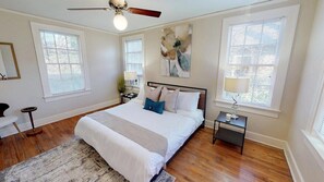 Main Bedroom with King Bed and safe-rest mattress encasement and white sheets.