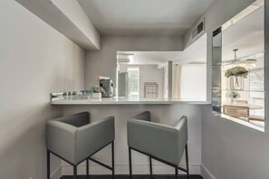 Stylish bar seating at the bar, perfect for casual meals or chatting with the chef.